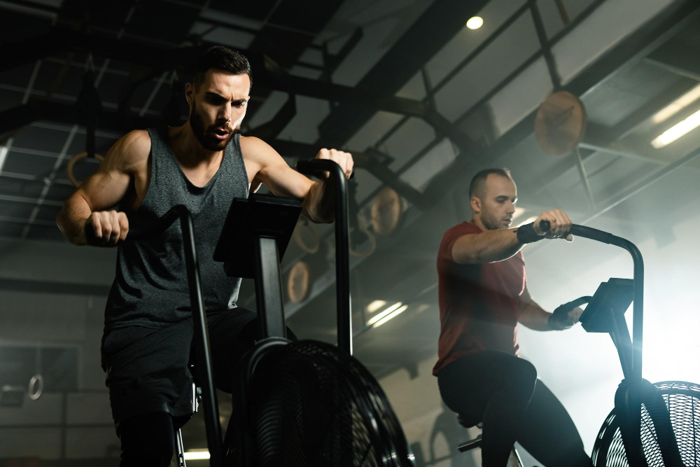 Two men on cardio equipment